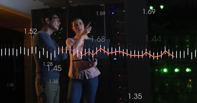 Image of data processing over diverse couple using laptop in server room