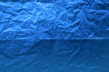 Painted classic blue tone color on environmental friendly food wrap blank kraft paper texture background with space