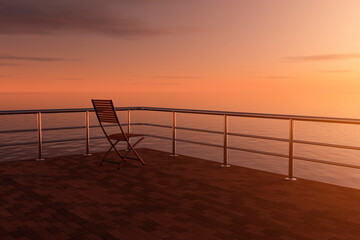 Fototapeta na wymiar One beach chairs in the rays of the setting sun.