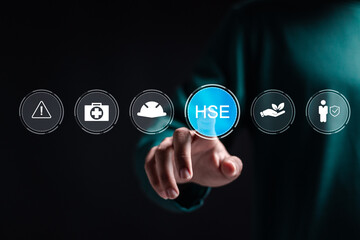 HSE, Health safety environment concept. Person touch virtual HSE icon for business and organization. Standard safe industrial work and industrial. - obrazy, fototapety, plakaty