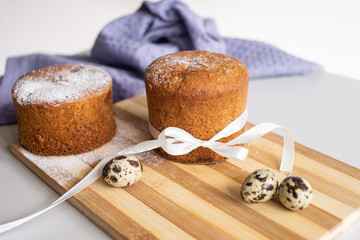 Easter pastries. Quail eggs are lying near the Easter cake