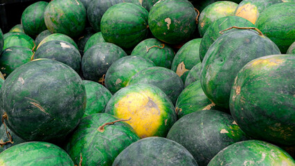 pile of watermelons, watermelons that are ripe and ready to eat