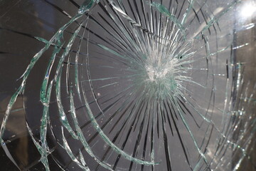 crashed glass  impact ,  window shatterd by gunshot