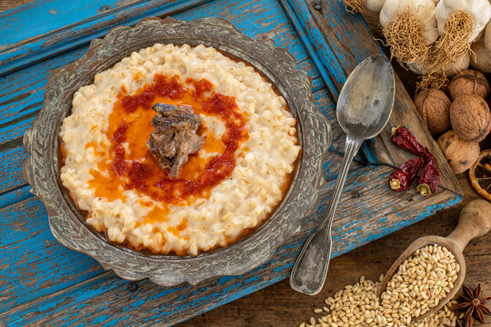 Harees or keşkek at the dining table . A meal with wheat and meat. 