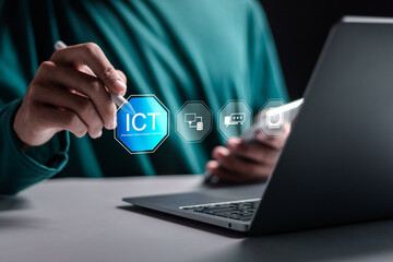 ICT, Information communication technology concept. Businessman use laptop with virtual screen of ICT icon for global technology. network, website and database.