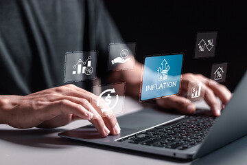 Inflation and tax concept. Person use laptop with virtual inflation rate icon for inflation...