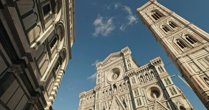 architecture of the Basilica of Santa Maria del Fiore in Florence, Italy. Beautiful facade of a historic cathedral with a tower in a touristic city of Europe. High quality 4k footage