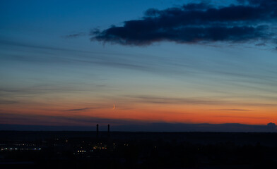 Dramatic dark moody blue and orange sunset sky. Natural background
