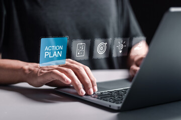 Action plan concept. Person use laptop with virtual screen of action plan for business and marketing. objective, strategy, Plan and implementation.