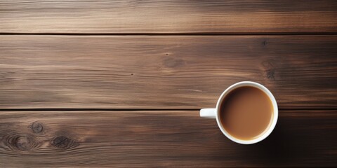 Empty cup of coffee or tea, mockup with hot beverage on wooden table background (top view)