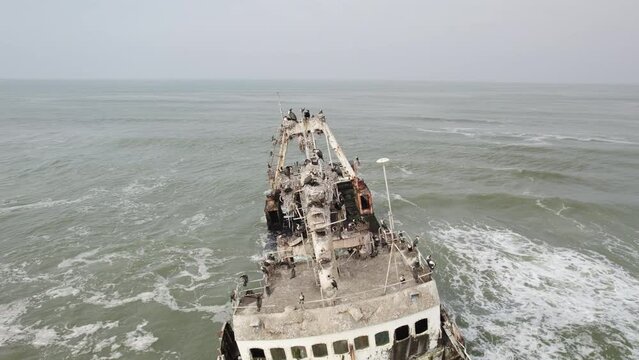 Shipwreck off the coast of Africa. Rusty Ship