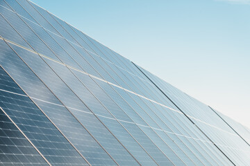 Fototapeta na wymiar close detail of solar panels in photovoltaic solar park, bright sunny day with blue sky