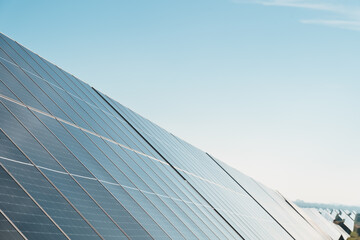 close detail of solar panels in photovoltaic solar plant, bright sunny day