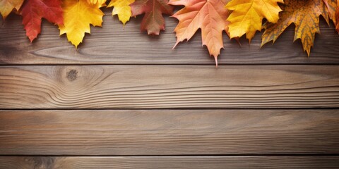 Fall foliage on wooden surface with room for text.
