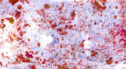 Abstract texture background. Red drops and spots of various sizes, sometimes green. Chaotically scattered on blue and white background. The colors mix to form pink and purple shades. Soft, monotonous.