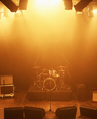 Concert, band and drums at stage for performance with instruments for live sound or gig. Music...
