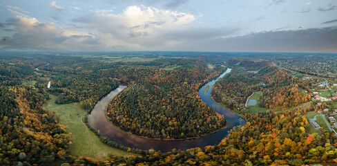 panoramic aerial view of the gauja river meandering through the colorful autumn landscape of...