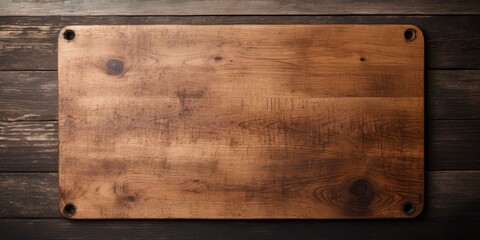 Vintage cutting board set on old wooden table, top view, with space for text or product. Cutting board with black spot on table. - obrazy, fototapety, plakaty