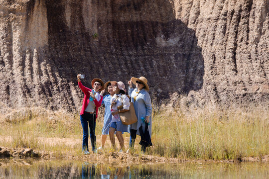 Asian senior elderly healthy group of females selfie taking picure together at natural park, pensioner friends recreation traveling freedom holiday vacation after retirement, aging society lifestyle