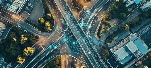 A sprawling metropolis, captured from above, reveals a complex web of roads intersecting at a bustling junction, surrounded by towering skyscrapers and city buildings illuminated by the warm glow of 
