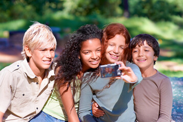 Children, friends and embrace outdoors in selfie for social media, camera and memories. Photograph, technology and profile picture on holiday or vacation in nature, smile and hug in post update