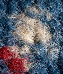 Texture of blue knitted fabric as background.