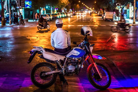 Yazd, Iran - October 21, 2016: Policeman with motorbike on a street in Yazd