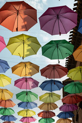 Obraz premium Background of colorful umbrellas decorated on a street 