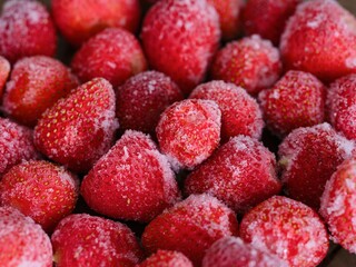 A close-up shot of a  frozen strawberries.