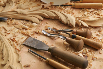 Plane jointer carpenter or joiner tool and wood shavings. Woodworking tools wooden table. Carpentry workshop