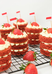 Mini red velvet cake with cream cheese and strawberry. Celebration of August 17, Indonesia's Independence Day. Selective focus.