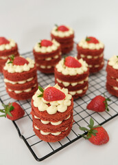 Mini red velvet cake with cream cheese and strawberry. Celebration of August 17, Indonesia's Independence Day. Selective focus.