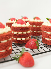 Mini red velvet cake with cream cheese and strawberry. Celebration of August 17, Indonesia's Independence Day. Selective focus.