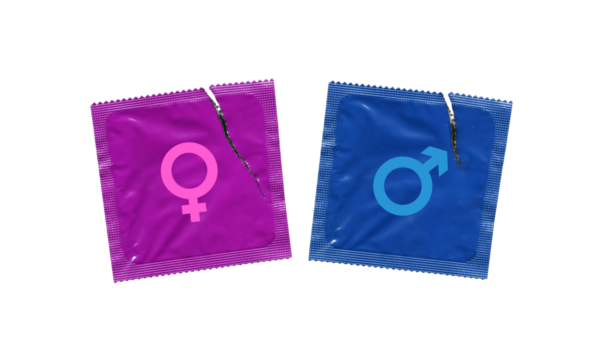 male and female gender signs on blue and pink torn condom wrappers