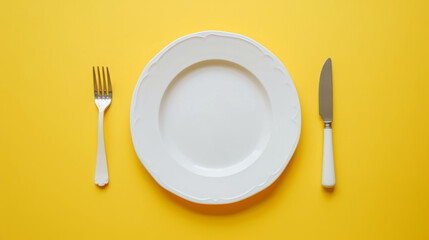 Top down view of a white plate isolated on yellow background with fork and knife with copy space - Powered by Adobe