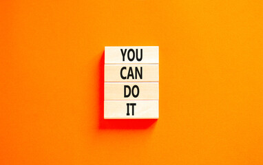 You can do it symbol. Concept word You can do it on beautiful wooden block. Beautiful orange table orange background. Business motivational you can do it concept. Copy space.