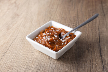 Delicious salted caramel in a white bowl