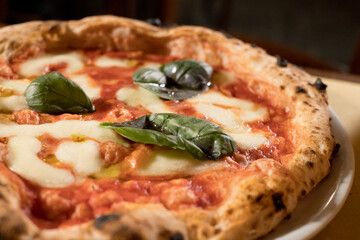 Experience street food by tasting freshly baked pizza made in Naples in multiple flavors and various types