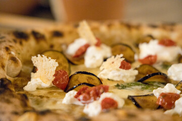 Experience street food by tasting freshly baked pizza made in Naples in multiple flavors and various types