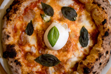 Experience street food by tasting freshly baked pizza made in Naples in multiple flavors and...