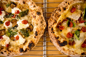 Experience street food by tasting freshly baked pizza made in Naples in multiple flavors and...