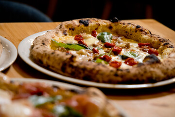 Experience street food by tasting freshly baked pizza made in Naples in multiple flavors and various types