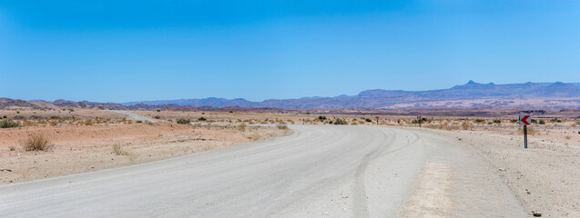 C37 gravel road bending in desert, north of Ais,  Namibia
