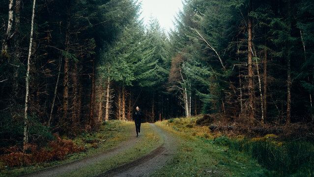 woman running in the woods