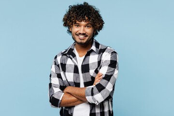 Young smiling happy Indian man he wears shirt white t-shirt casual clothes hold hands crossed...