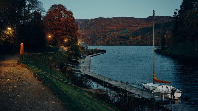 boats in loch ness at sunset
