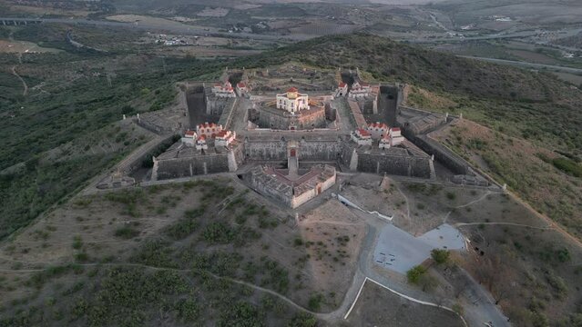Drone footage over the Fortress of Nossa Senhora da Graca at sunrise in Elvas, Portugal