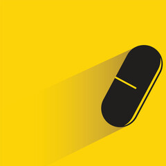 capsule with shadow on yellow background