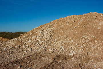 Mound of marble-like limestone fragments at a crushed stone quarry