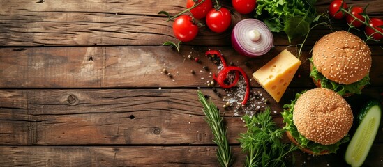 Top view of burger ingredients on rustic wooden table with toned image.